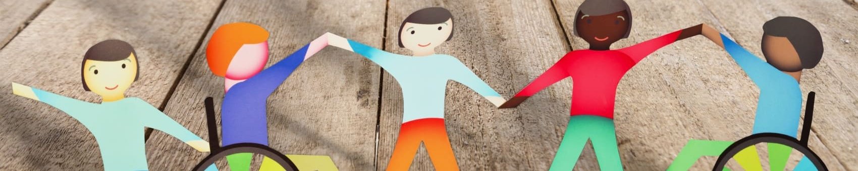 Papierfiguren halten sich an den Händen