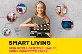Videowettbewerb "Smartes Zuhause, smarte Städte" Mädchen dreht Video mit Filmklappe