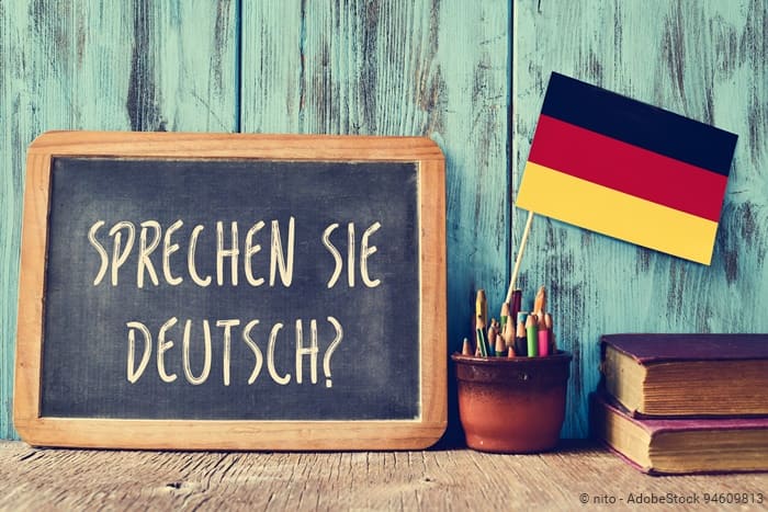 Tafel mit dem Schriftzug "Sprechen Sie Deutsch?"